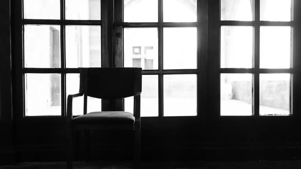 Empty chair by window — waiting for change